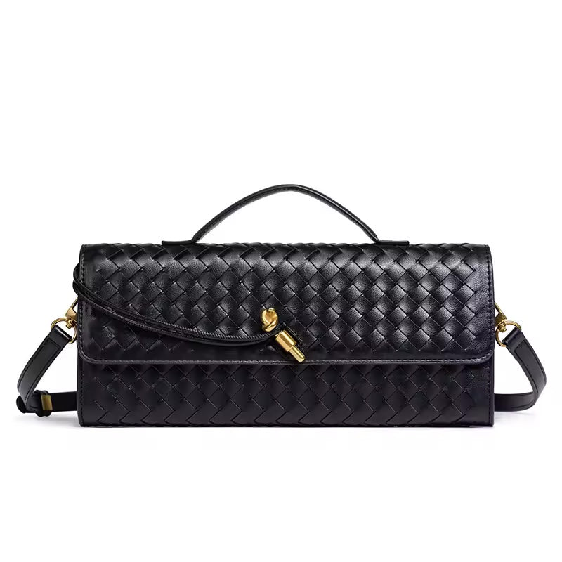 The Andie woven vegan leather shoulder clutch in classic black with gold knot toggle and detachable crossbody strap by Karvelle