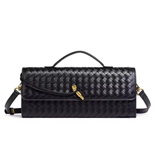 The Andie woven vegan leather shoulder clutch in classic black with gold knot toggle and detachable crossbody strap by Karvelle
