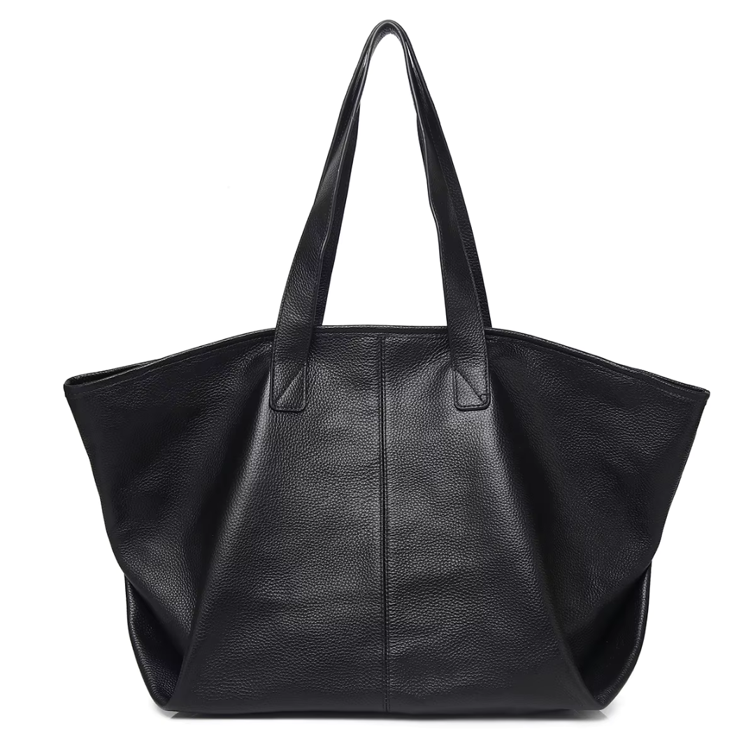 The Celeste genuine leather mini tote in black - angled front view showing bag shape and proportions