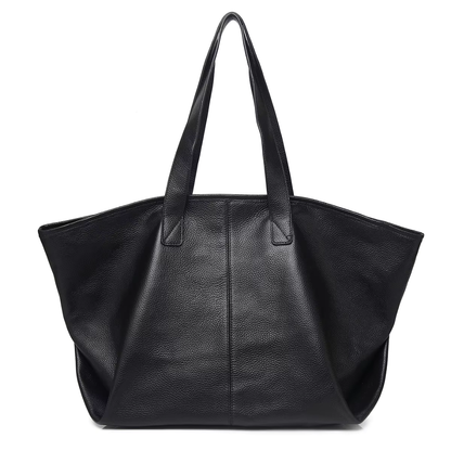 The Celeste genuine leather mini tote in black - angled front view showing bag shape and proportions