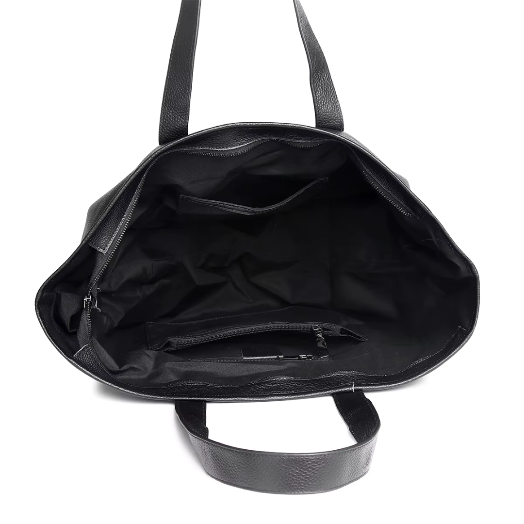 Interior view of The Celeste black leather mini tote with polyester lining and zip pocket