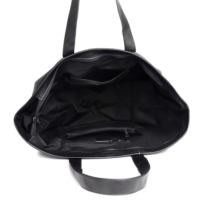 Interior view of The Celeste black leather mini tote with polyester lining and zip pocket
