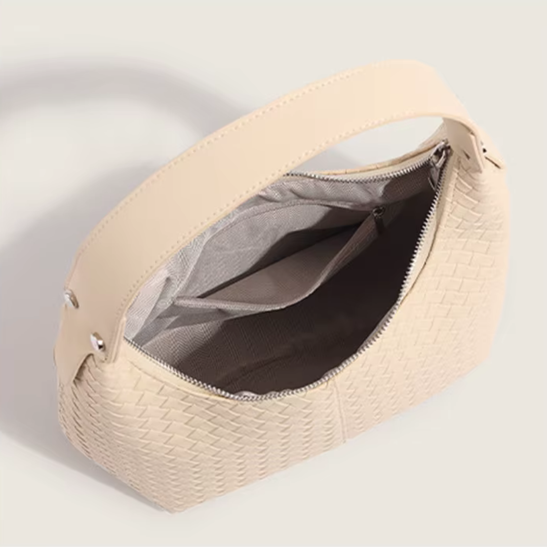 Interior view of soft ivory woven tote with polyester lining and zipper pocket