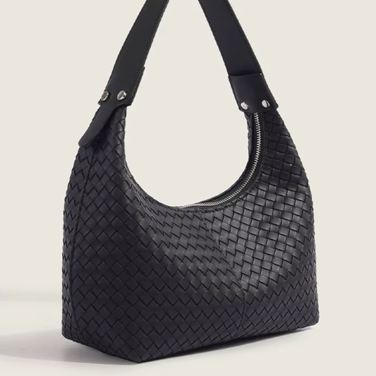 The Colette woven vegan leather mini tote in classic black - front view showing woven texture and shoulder strap