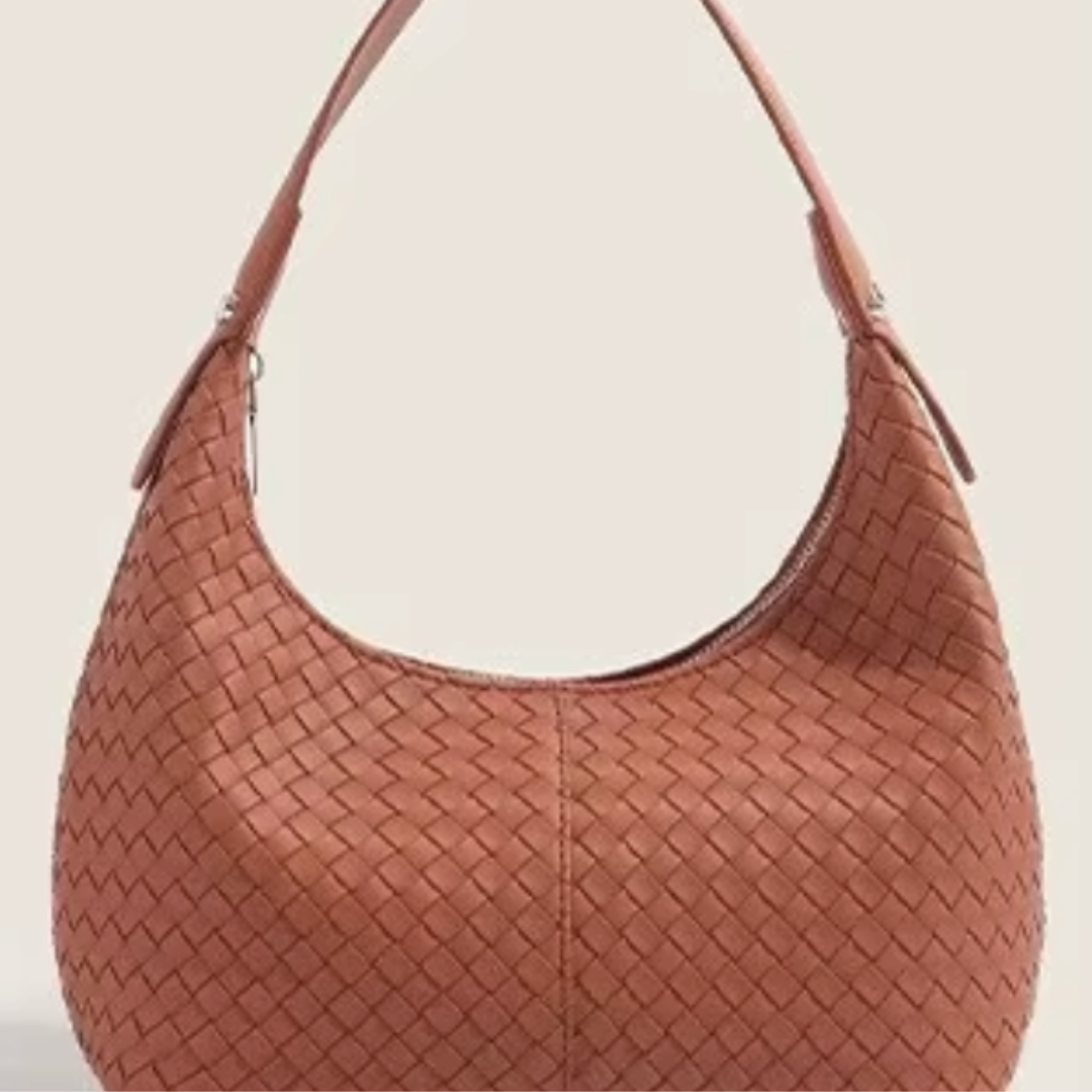 The Colette woven vegan leather mini tote in cognac - front view showing warm brown woven texture and shoulder strap