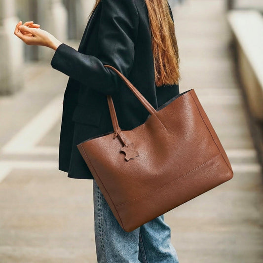 The Isla oversized leather shopper tote in Espresso Brown, worn over the shoulder