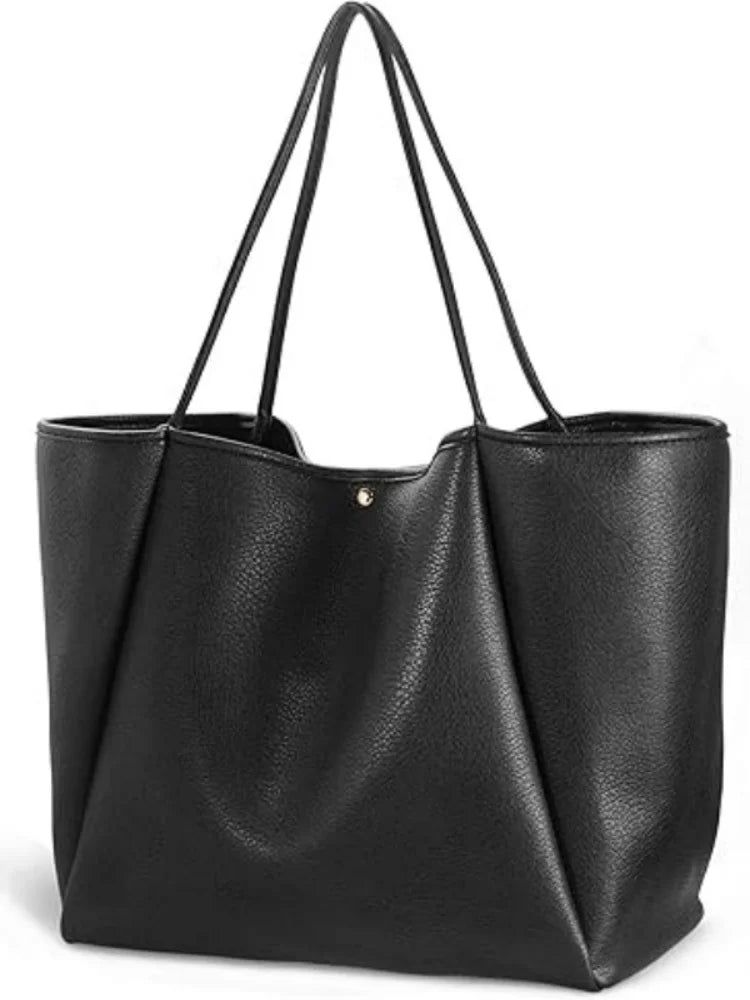 The Juno oversize vegan leather weekender tote in Black, front view